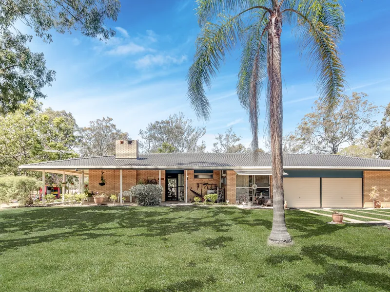 ESTABLISHED FAMILY HOME ON PICTURESQUE 10 ACRES