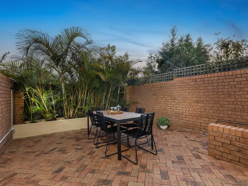 Stylish north-east facing townhouse at rear of complex