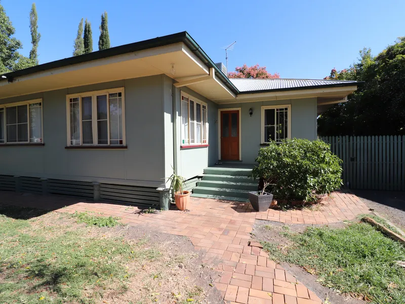 Cottage style home with a large private backyard