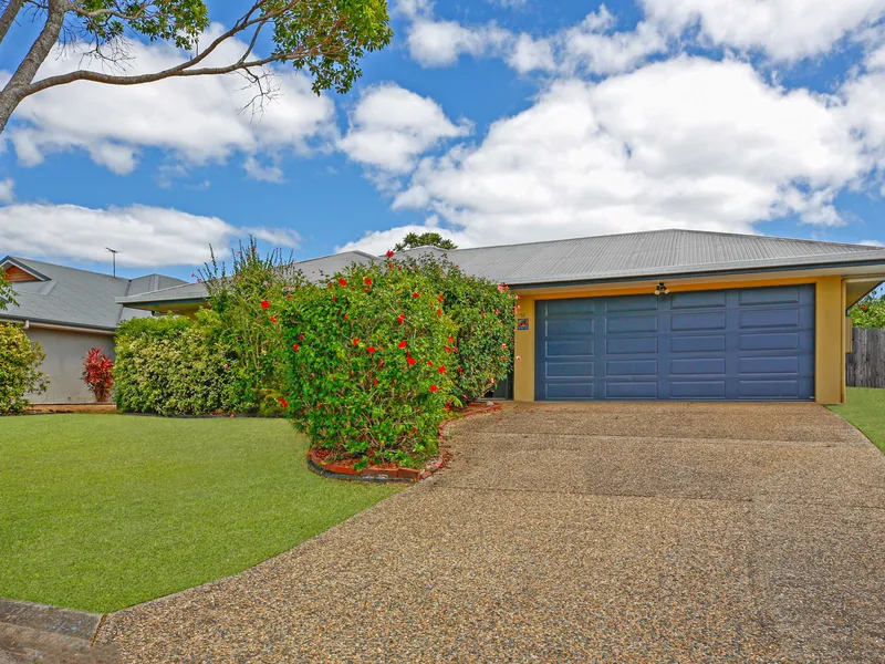Family home with multiple living areas and pool.