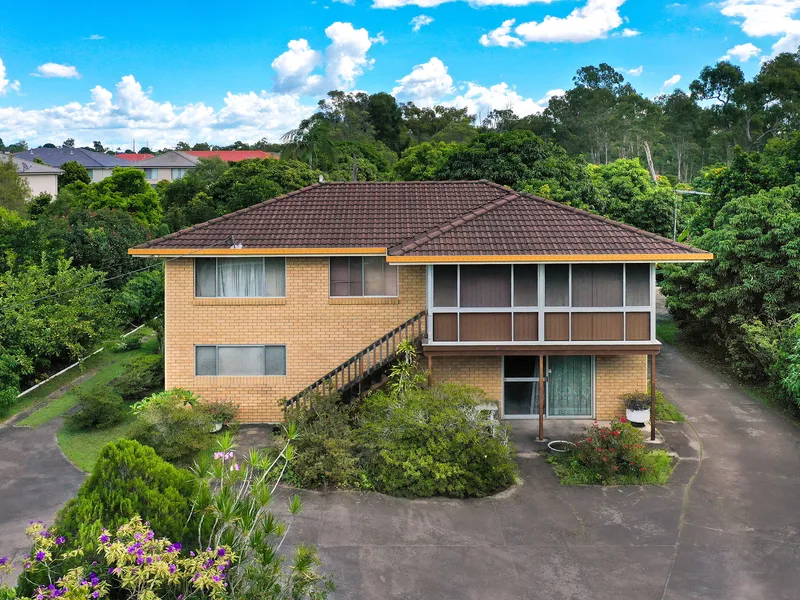 SPREAD OUT ON SUBURBAN ACREAGE!