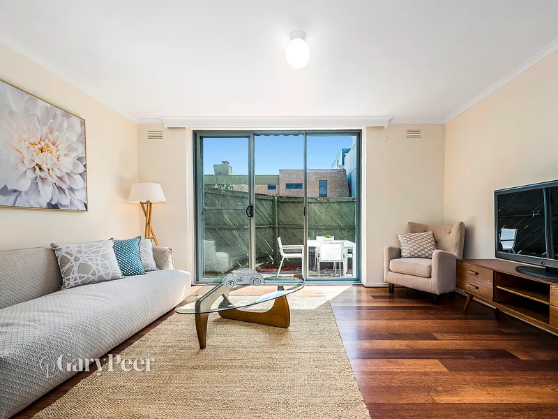 Three bedrooms, two courtyards & a garage!