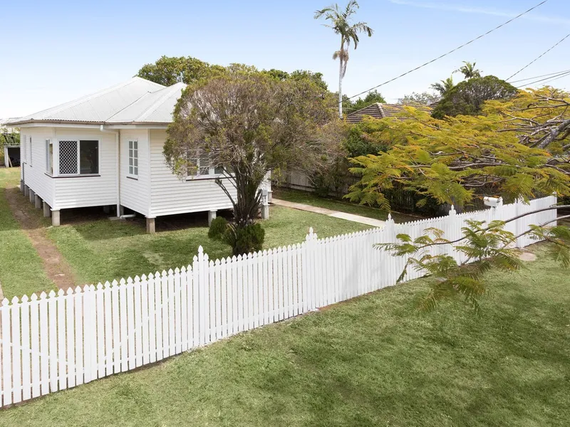 Fresh House With White Picket Fence on Quiet Street