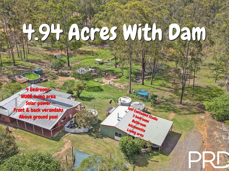 4.94 ACRES WITH 4 BEDROOM BRICK HOME PLUS A SELF CONTAINED STUDIO.