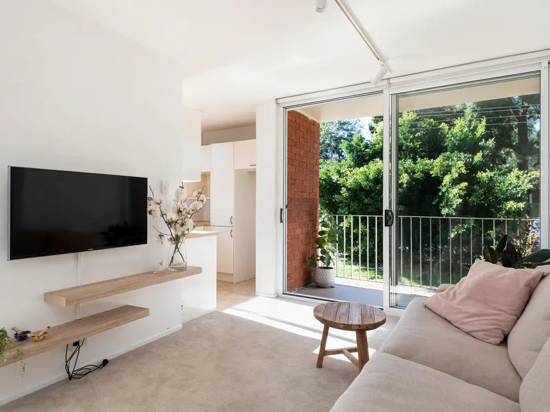 1 bedroom apartment at rear of block with lock up garage