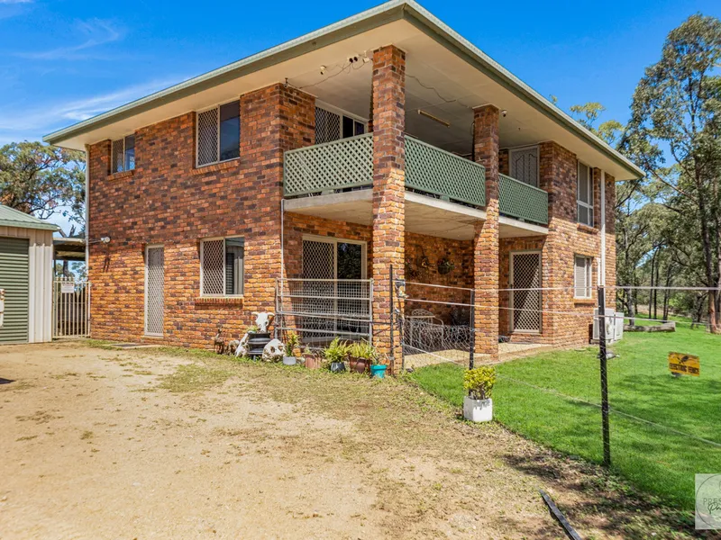 Two-Story Haven on 25 Acres: Embrace Rural Living with Hobby Farm Potential
