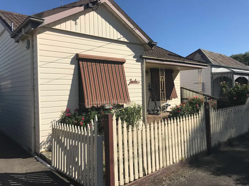 NEAT AND TIDY CENTRALLY LOCATED HOME WITH SHED.