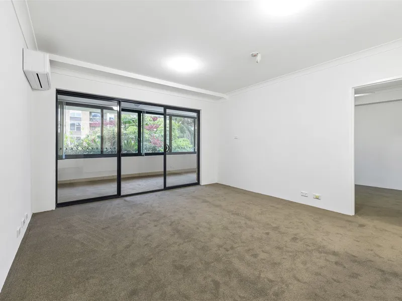 ABSOLUTELY HUGE 1-2 BEDROOM APARTMENT WITH ENCLOSED BALCONY & PARKING