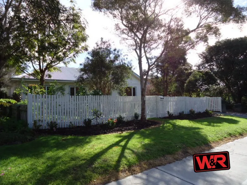 Perfect Location Tucked behind a white picket fence