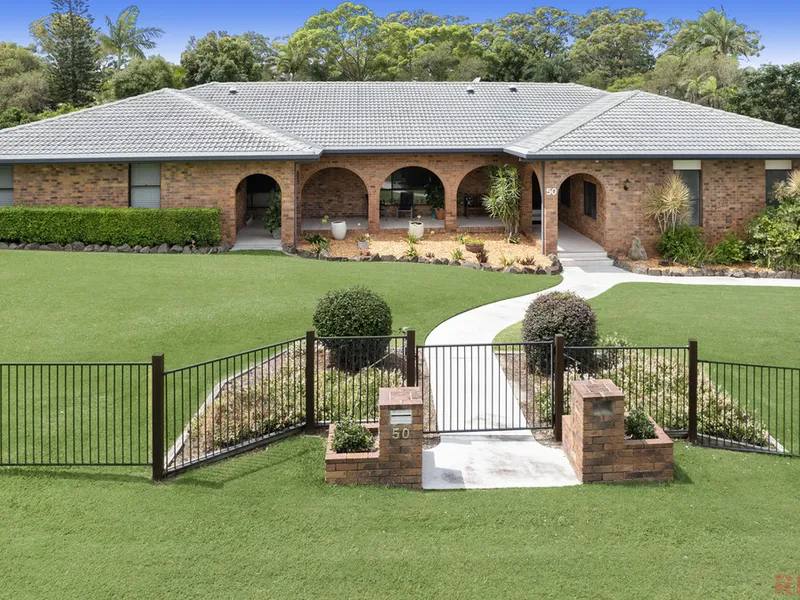 TIMELESS ACREAGE WITH DUAL LIVING!