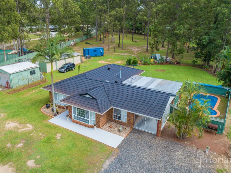 Fire up the ride-on! Gorgeous family home on a flat 2-acre block.