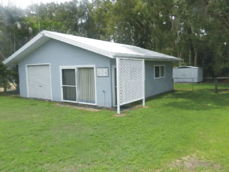 NEAT DWELLING BUILT TOWARDS REAR OF BLOCK !