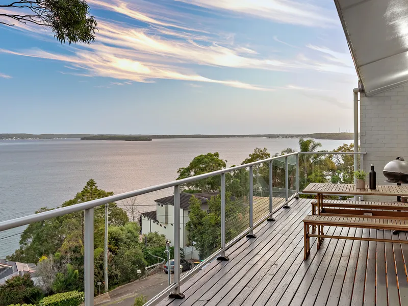 Lakeside Elegance Framed by a Spectacular Backdrop