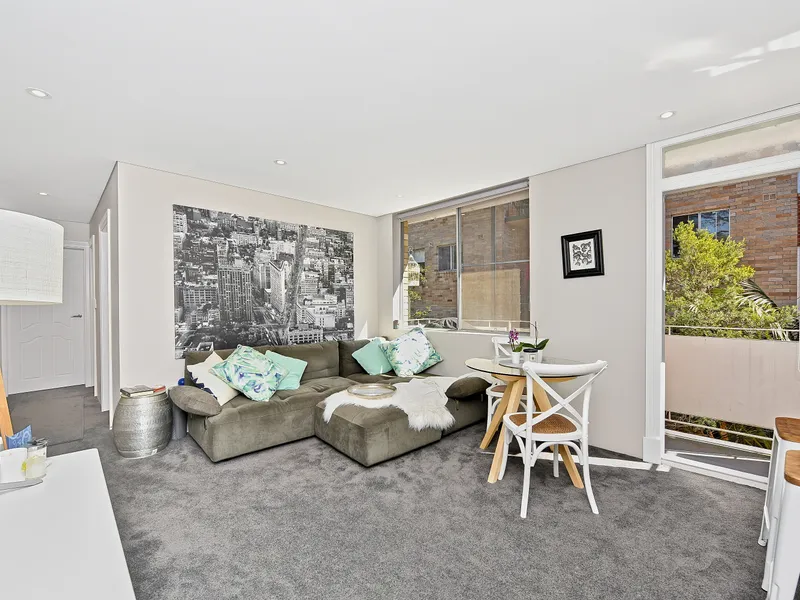 WELL MAINTAINED, SUN FILLED APARTMENT WITH COVERED TANDEM CAR SPACE & 2 BALCONIES