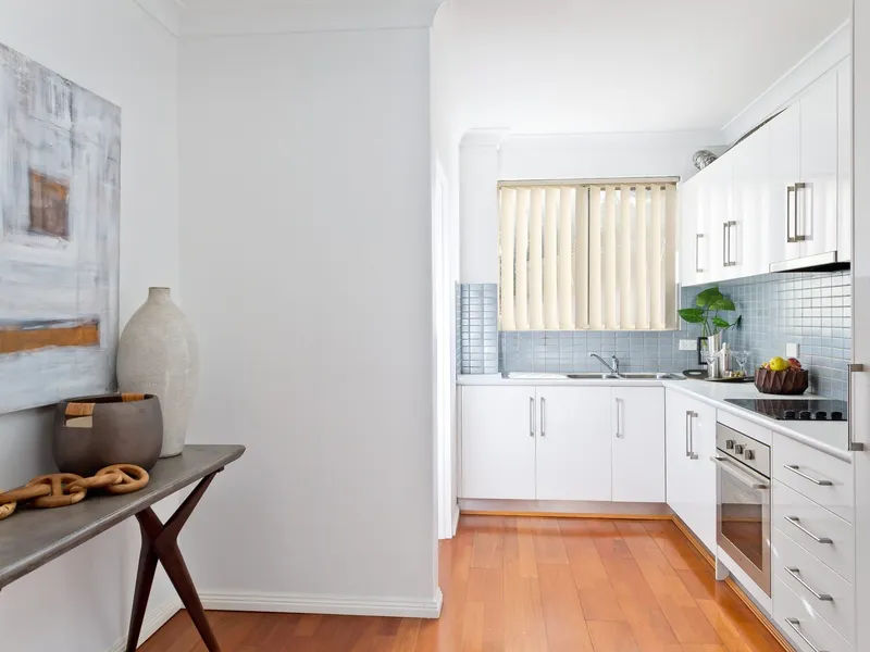 Enjoy all of the benefits this area has to offer with this elevated first floor unit