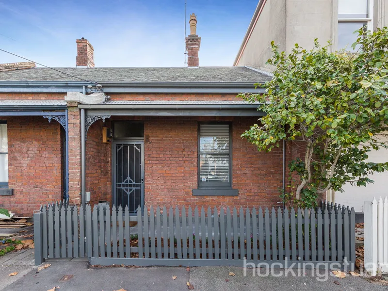 Hidden beauty in this classic Carlton Townhouse.