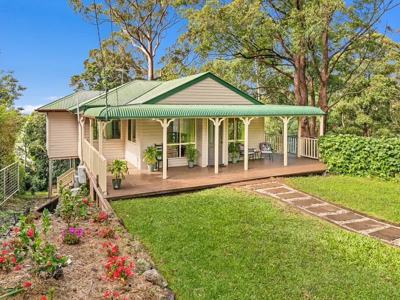 Charming cottage with wraparound verandah and coastal views