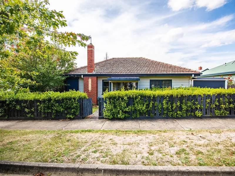 A Striking Weatherboard Home Nestled In Soldiers Hill