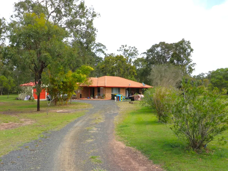 LOW MAINTENANCE BRICK HOME ON ACREAGE