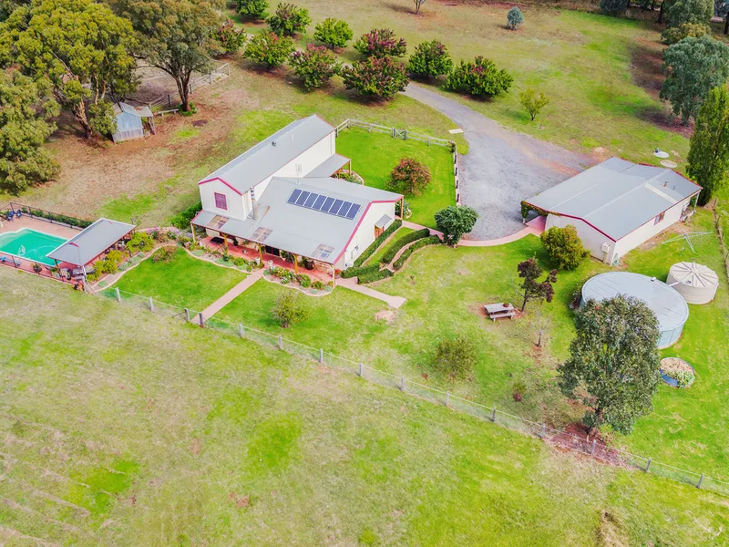 Your own private country oasis nestled on 2 hectares, complete with pool and multiple sheds