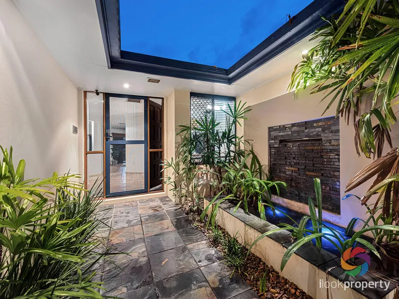 Family home with 3 bedrooms plus study/4th bedroom nestled in your own private tropical oasis.