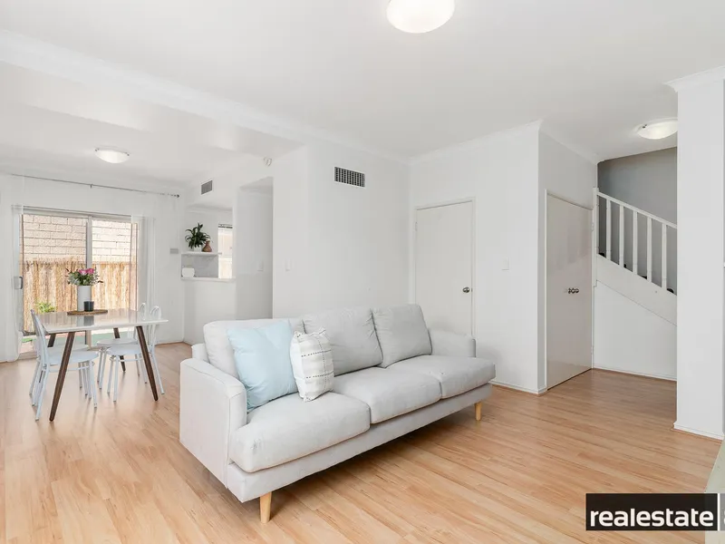 White, bright and ready to delight! Private and secure rear positioned townhouse