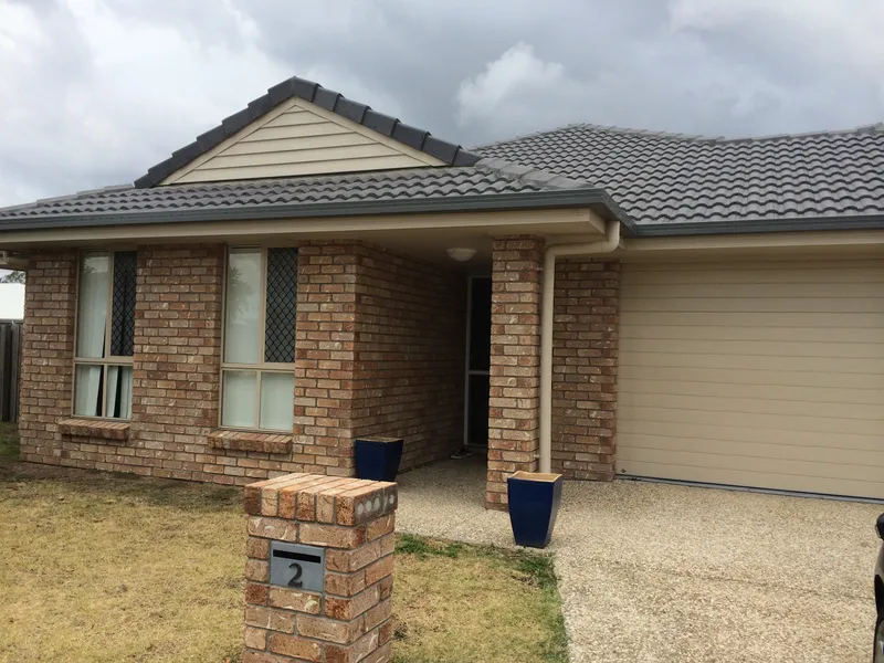 HOME WITH TWO LIVING AREAS JUST ACROSS FROM THE PARK IN ORMEAU RIDGE