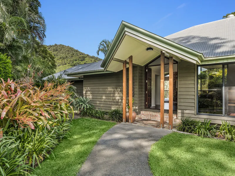 Timeless Elegance Meets Resort Living on 1.5 Town Water Acres