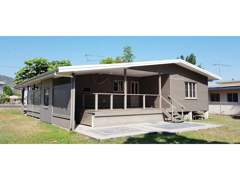 Neat & tidy beachside lowset 3b/r home has glimpses of the sea