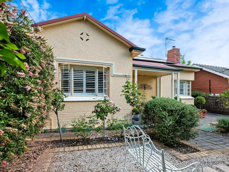 A delightful 3 bedroom character home built in 1950 with street and side access surrounded by pretty gardens on 411sqm (approximately).
