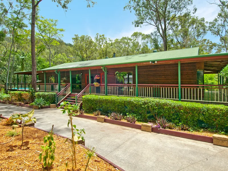 2.6 Acres of Privacy, Unique Home with Beautiful Gardens!