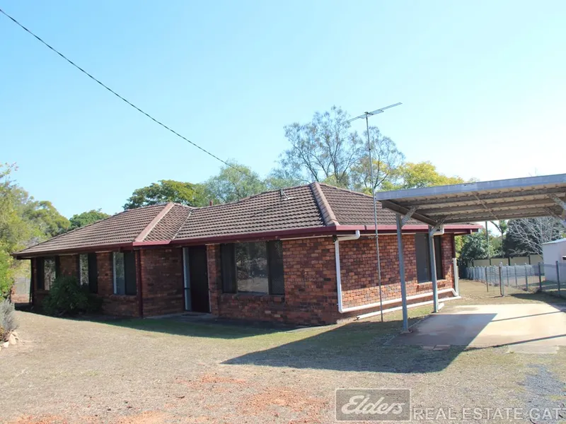 4 BEDROOM BRICK HOME ON LARGE BLOCK.