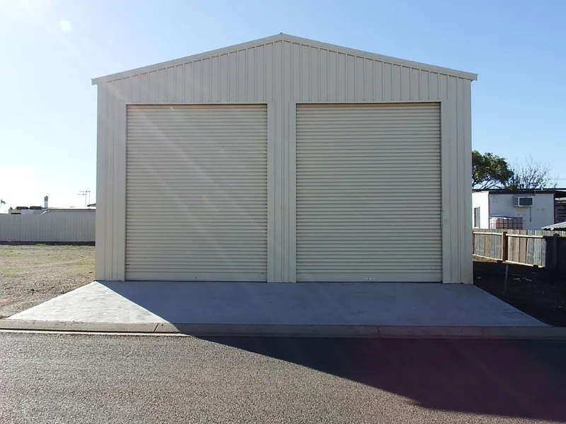 What a Shed!!!  Big enough for boats,caravan and storage. Or you may consider to build a home . Or build a shed on the vacant block. Options! 