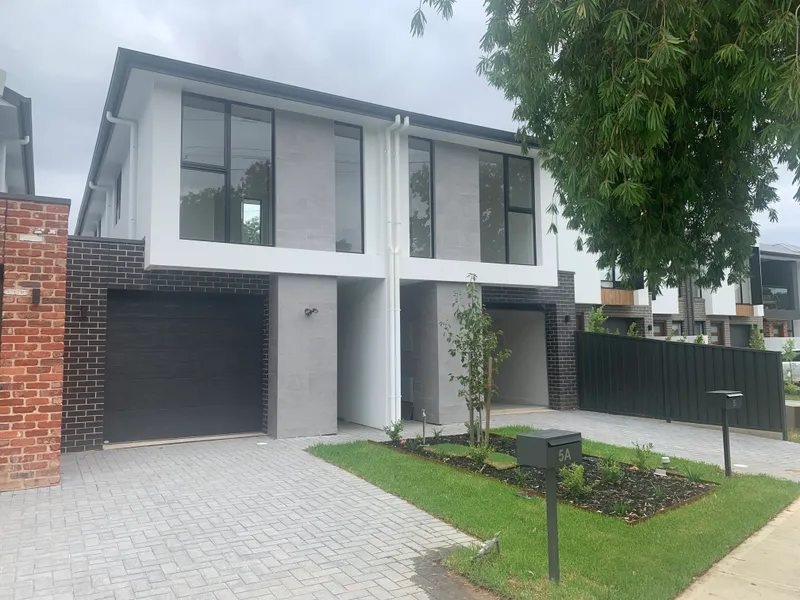 BRAND NEW, light filled townhouse