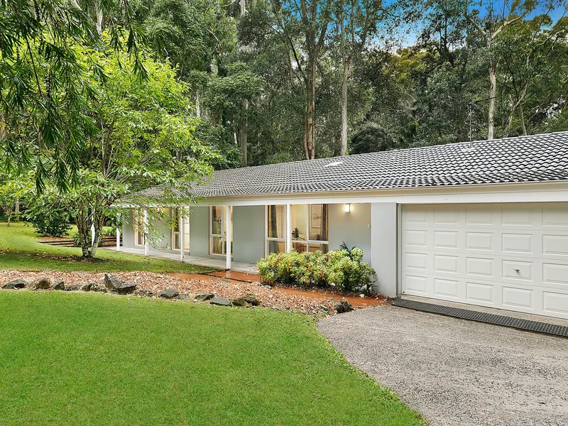 Immaculate single level home provides space, peace, and privacy in a fantastic location