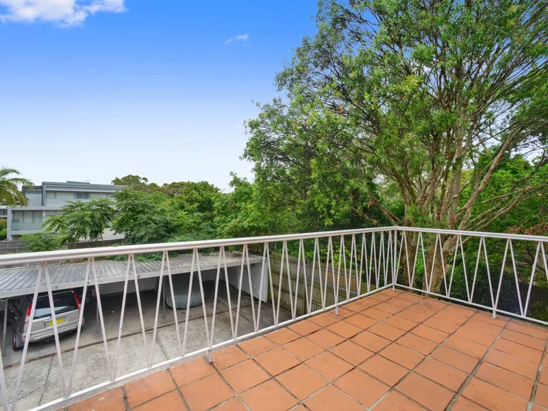 Peacefully Positioned Three Bedroom Apartment with Covered Parking