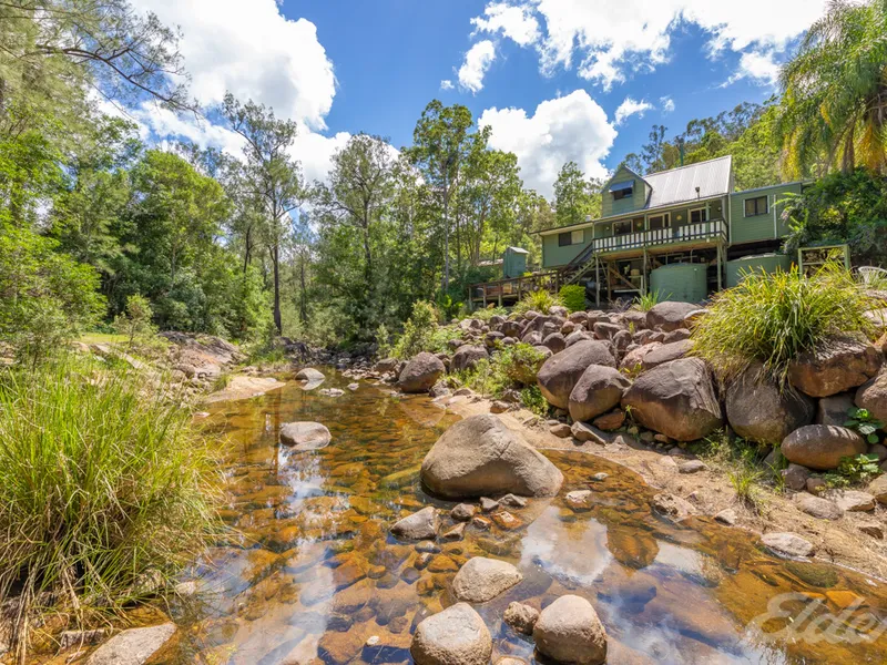6.5 Park Like  Acres with Sandy Creek in your  Unique Property