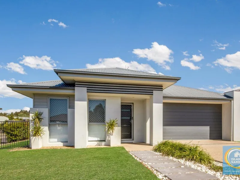 LOW SET CONTEMPORARY HOME ON A CORNER BLOCK OPPOSITE PARK