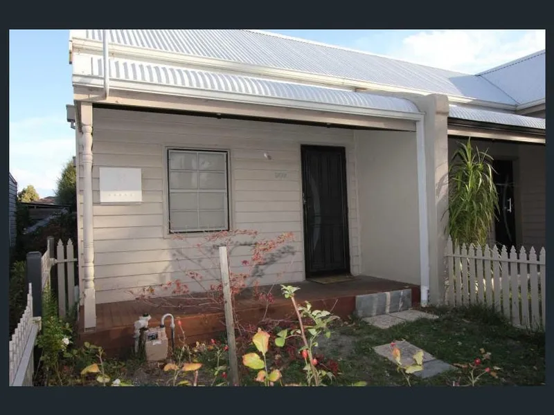Central townhouse with off street parking