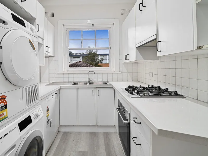 Charming two bedroom top-floor unit with sunroom