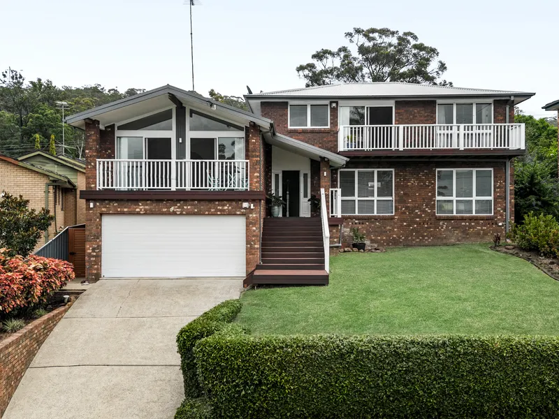 Spacious brick family home with lush surroundings and recent updates