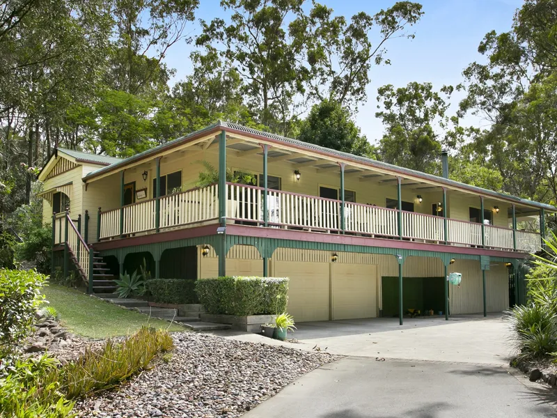 STUNNING QUEENSLANDER SET ON 1 ½ ACRES IN THE PRESTIGEOUS MT. NATHAN PARK ESTATE!