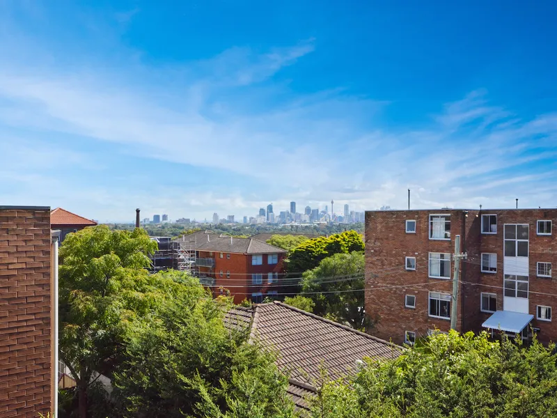 UPDATED APARTMENT WITH CITY SKYLINE VIEWS & LOCK UP GARAGE 