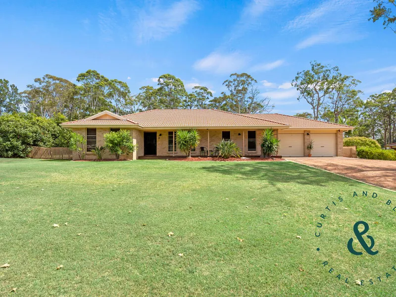 Stylish and Spacious Living with a Solar-Heated Pool on Half an Acre