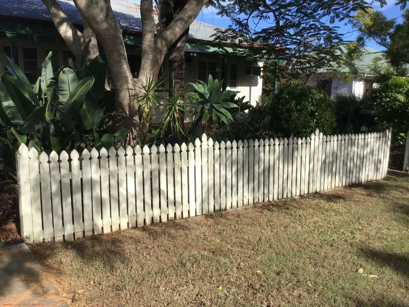 Solid timber home amongst lush gardens