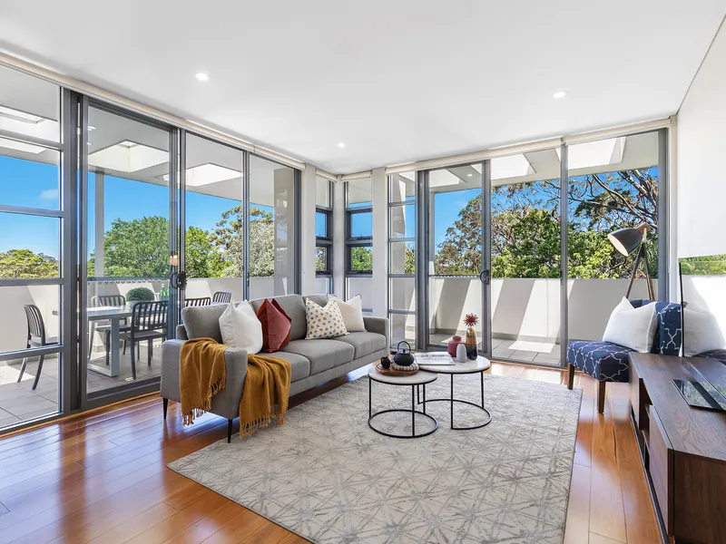 Enjoy superb convenience in this sub-penthouse apartment with scenic vistas