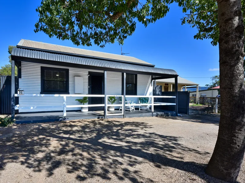 Charming 1900's Symmetrical Cottage