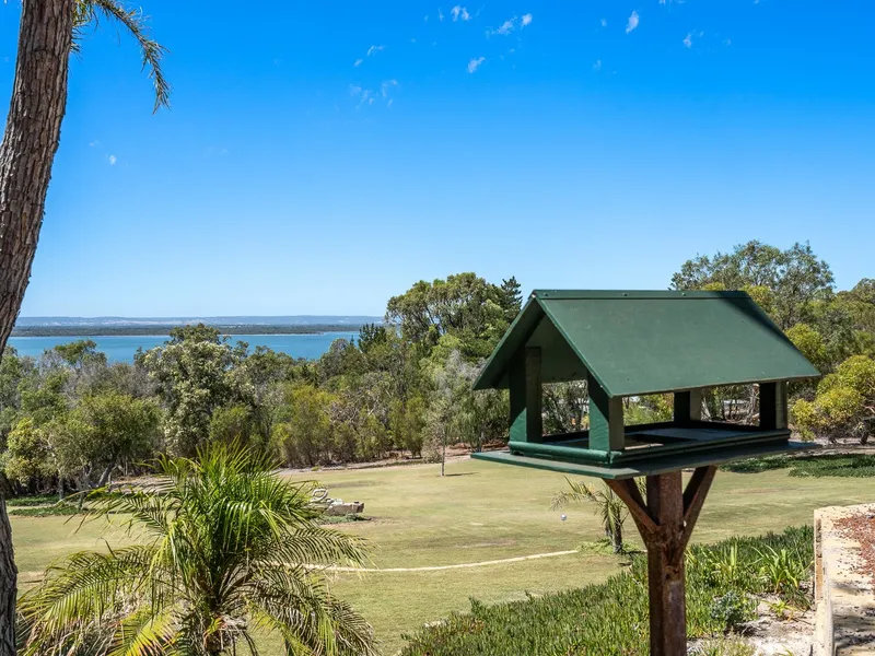 Welcome Home to Serenity – 5 Acres of Breathtaking 180 Degree Water Views