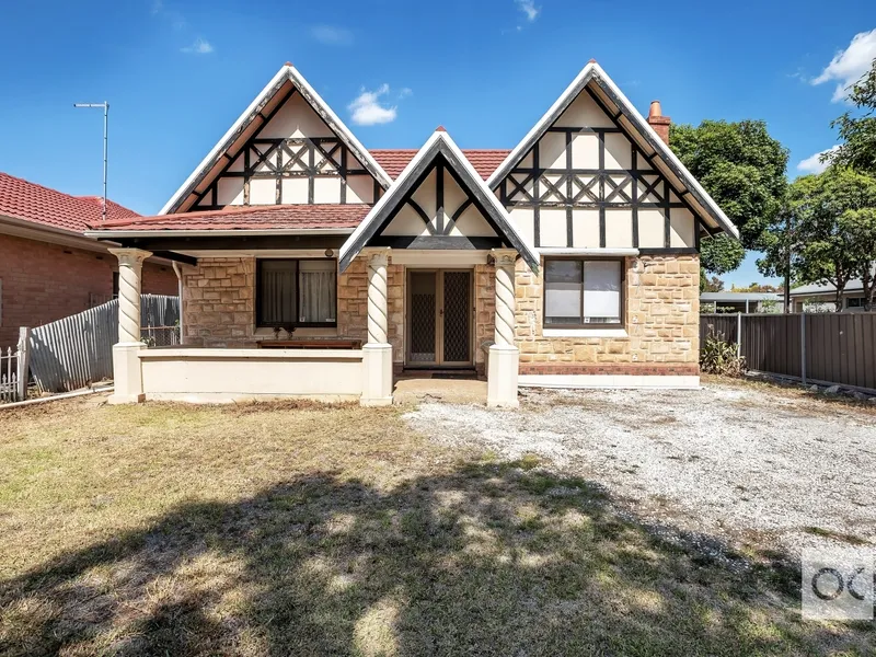 C1935 TUDOR WITH UNTAPPED POTENTIAL ON A PRIZED CORNER PARCEL