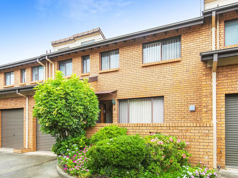 Brick townhouse offering low maintenance lifestyle